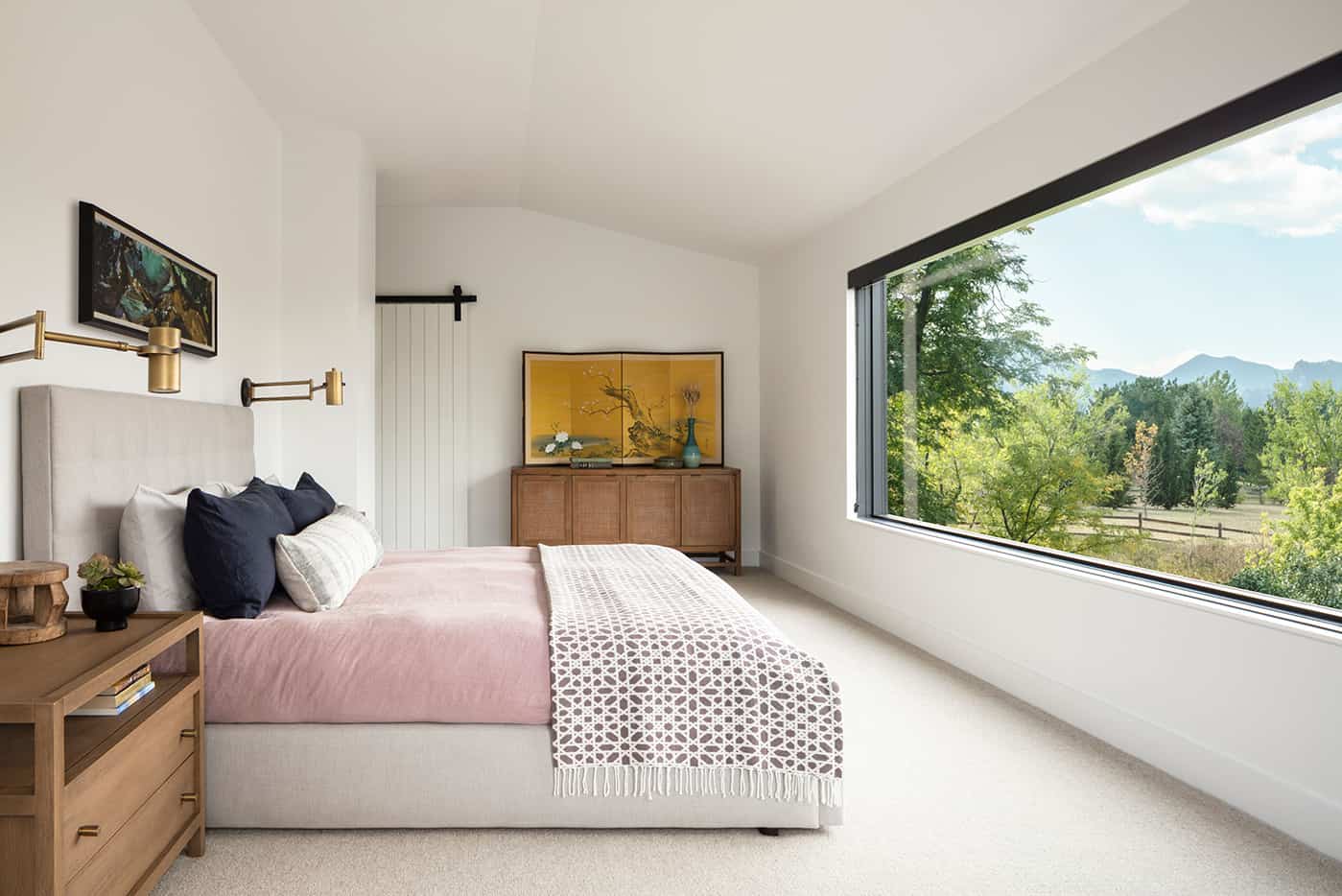 Master bedroom with view of flatirons in Boulder luxury custom home by Cottonwood Custom Builders